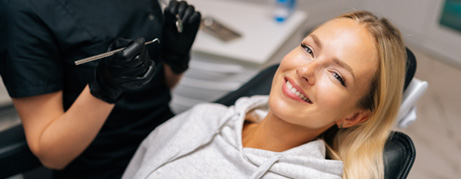 Woman smiling while relaxing in treatment chair