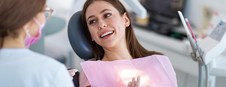 Woman smiling in the dental chair