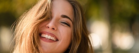 Woman smiling outside