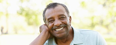 Patient in Commack smiling with dentures