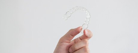 Patient holding clear aligner